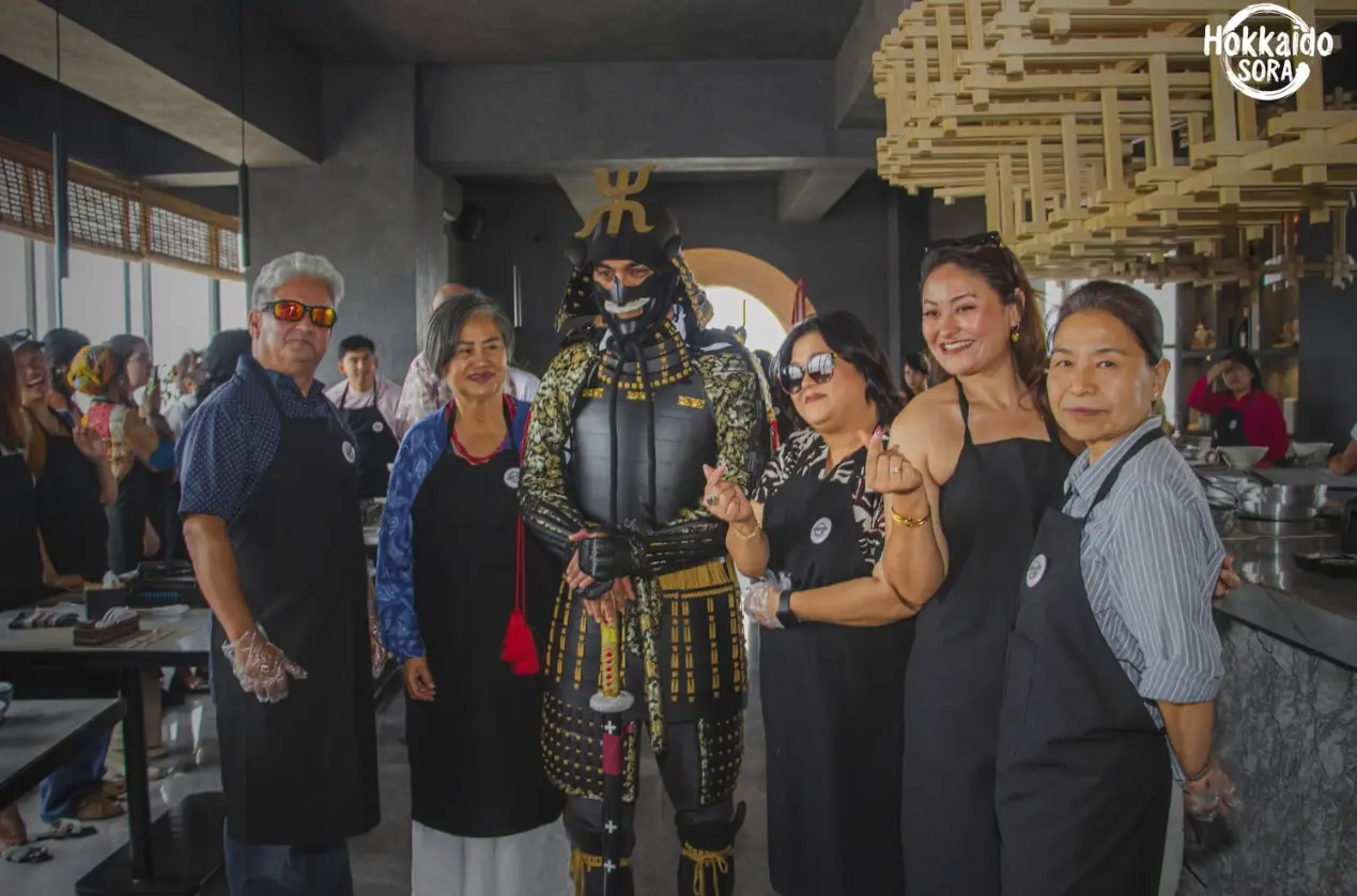 Guests with a samurai armour display at Hokkaido Sora.